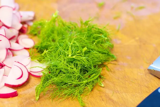 chop the fresh fennel fronds...