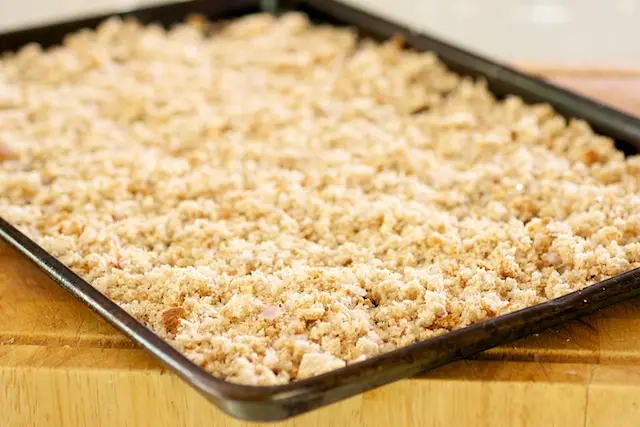 Spread the mixture evenly on the baking sheet.