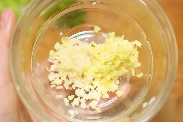 Add the minced garlic and ginger into a small bowl.