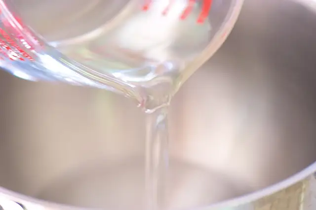 In a stander mixer, add the 2 ⅓ cups of warm water.