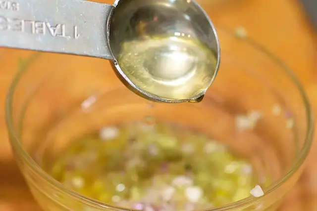 Add the white wine vinegar.