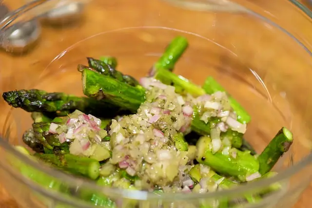 Pour remaining vinaigrette over the pan-seared asparagus.