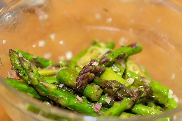 Toss until well coated, then place over the mixed greens.