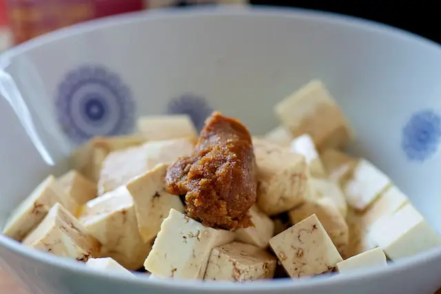 Add the miso paste or soy sauce if you don