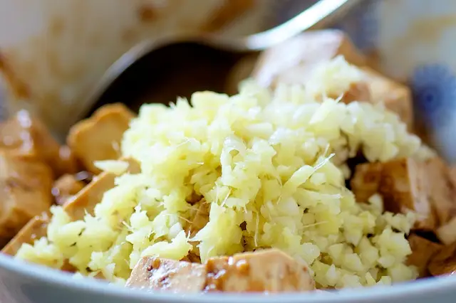 Add garlic and ginger into the tofu as well.