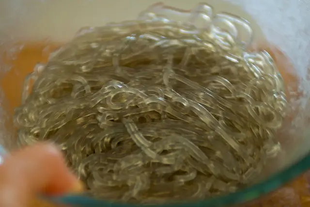 Rinse with cold water, drain well and mix with a little bit salad oil.