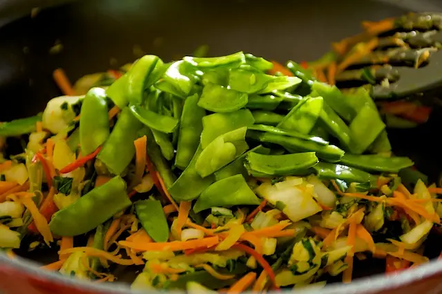 Add the snow peas.