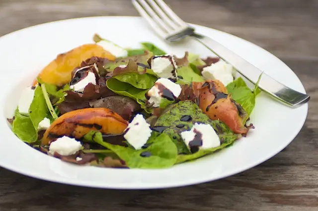 Grilled Peaches with Baby Greens, Goat Cheese & Balsamic Glaze