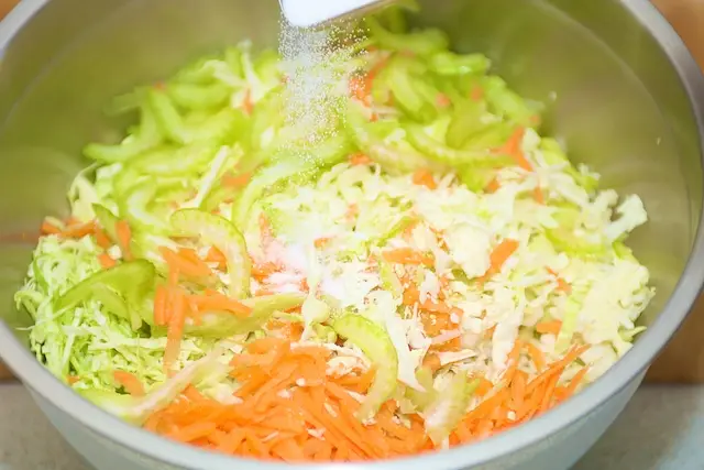 Sprinkle salt over the slaw.