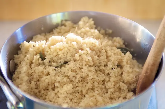 After 5 minutes, fluff the couscous with a fork.