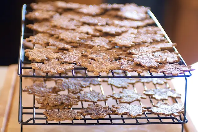 With a cookie lifter, transfer the crackers onto wire racks, and let cool completely.