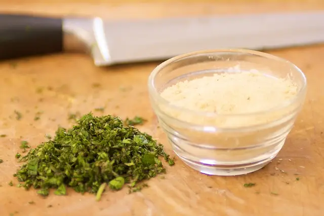 Finely chop the mixed herbs, and place 1 tablespoon of each garlic and onion powder into a small bowl.