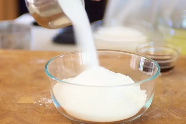 In a bowl add together the flour, ¾ cup sugar and salt.