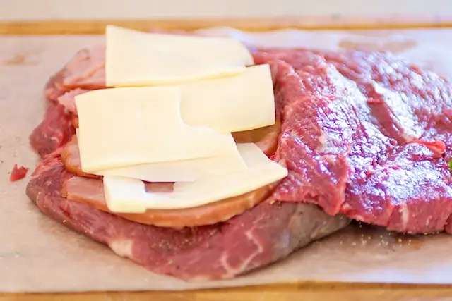 Add a layer of cheese on top of the ham