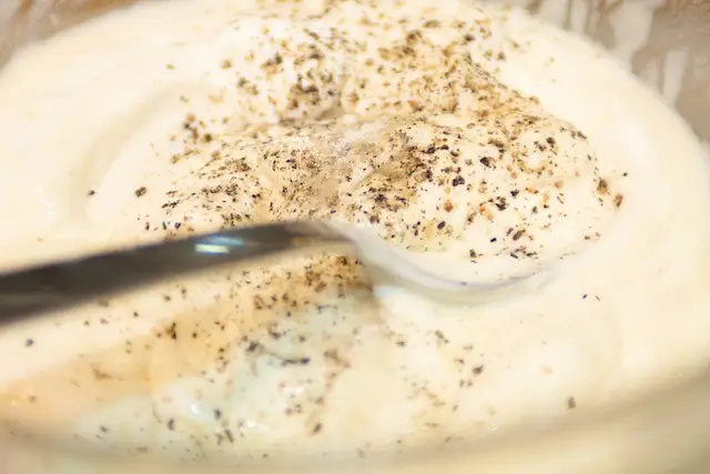 Add salt and freshly ground black pepper to taste and stir well.