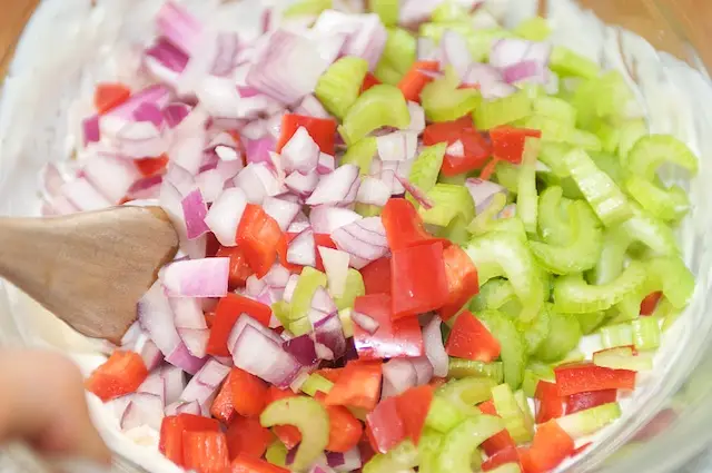 Add the celery, bell pepper and onions into the bowl.