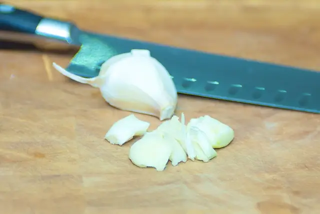 Peel and chop the garlic.