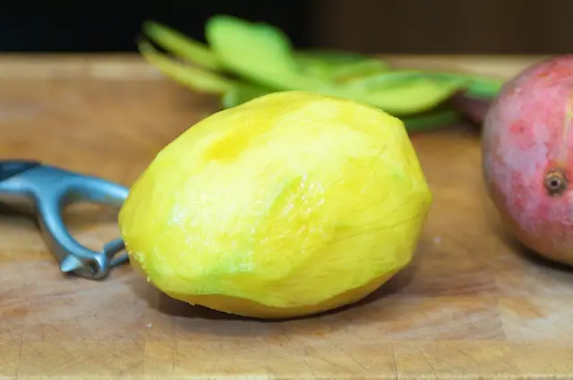 Prepare the mango. Peel it first.