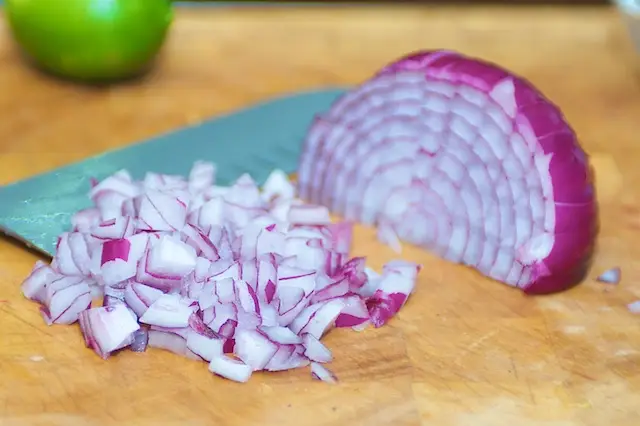 Chop the red onions.