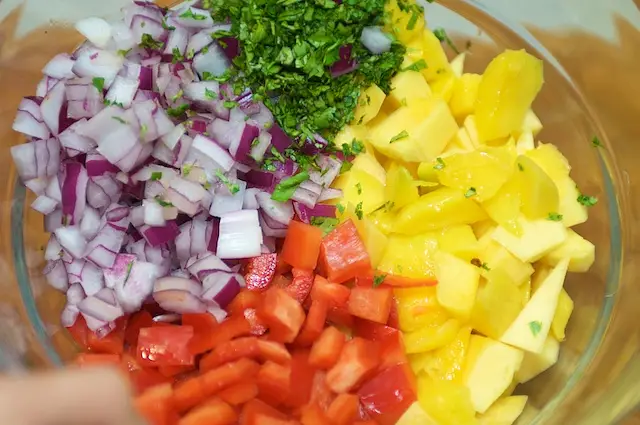 Add all the fresh things into the big bowl.