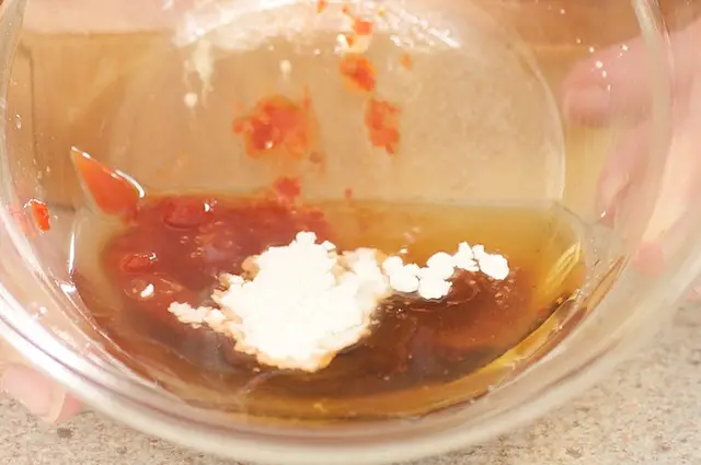 Add the sugar, rice vinegar, ketchup, soy sauce, sesame oil, chili garlic sauce, sherry and cornstarch to a small bowl.