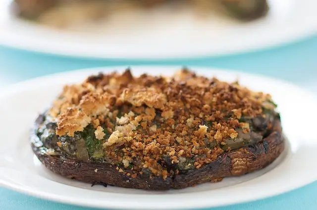 Place each portobello on a serving plate.