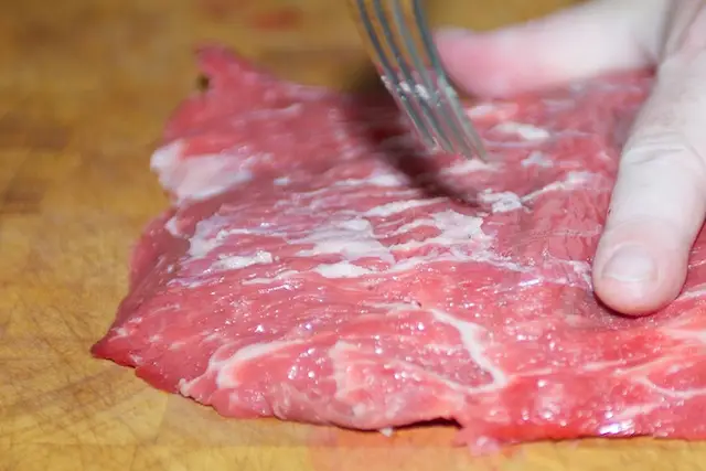 Pierce the steak all over with a fork