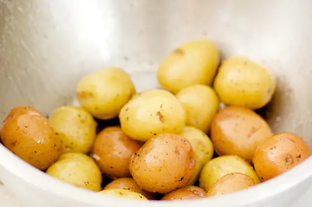 Toss the scrubbed potatoes in some olive oil, salt, pepper