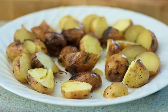 Boil and grill the new potatoes.