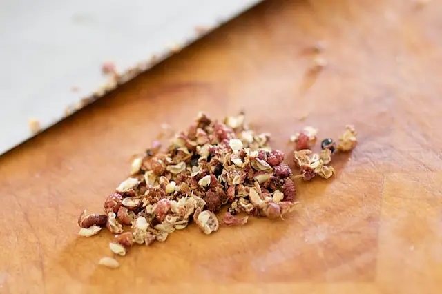 Finely mince or grind Szechuan peppercorns. 