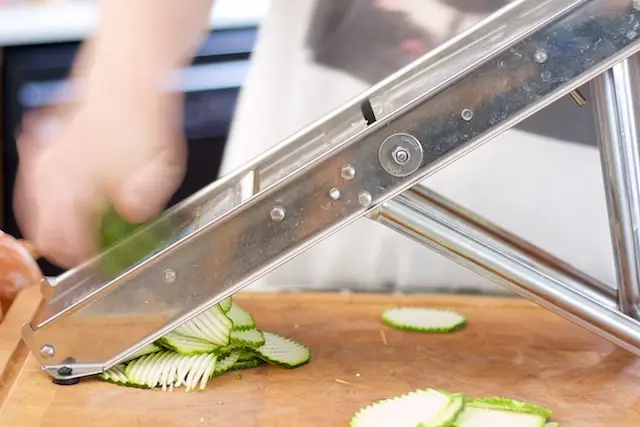 Slice the zucchini with a mandoline or by hand.