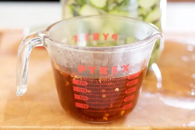 Or you can put it into a measuring cup, then pour from the cup into the jar.