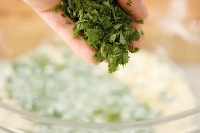 Add the freshly chopped sage leaves.