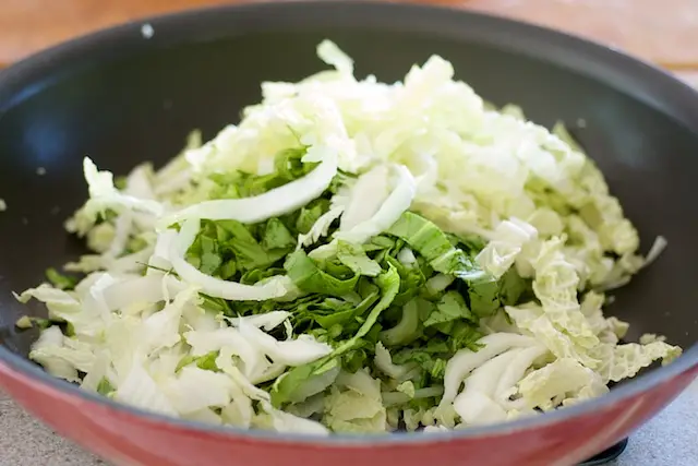 Add the bok choy and cabbage.