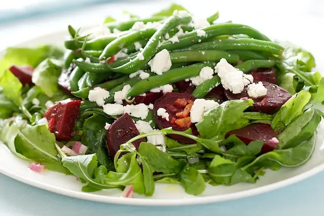 To assemble the salad.