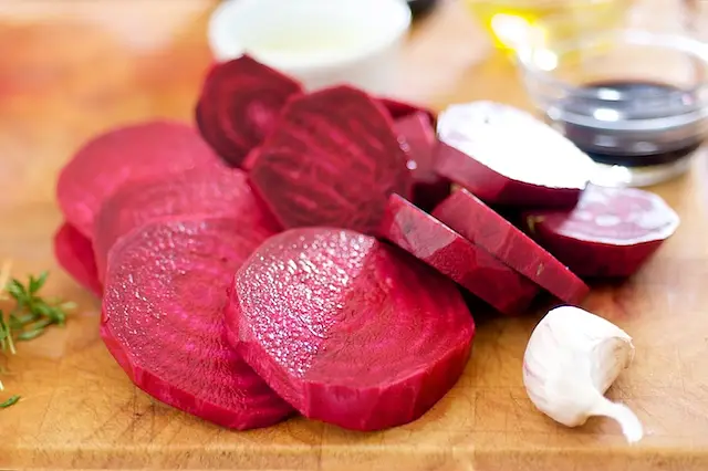 Peel the beets, and slice into 1-inch thick slices.