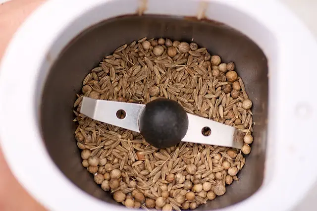 Meanwhile if you are using cumin and coriander seeds, add them into a coffee grinder.