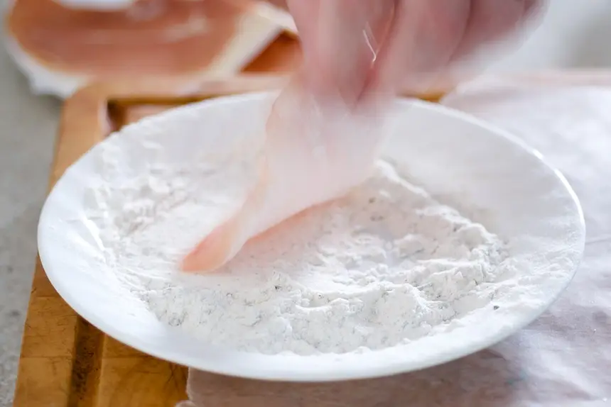 Dredge one side of each cutlet in the flour