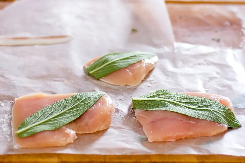 Place sage leaves on each chicken cutlet