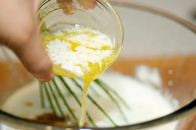 Add the melted butter and vegetable oil.