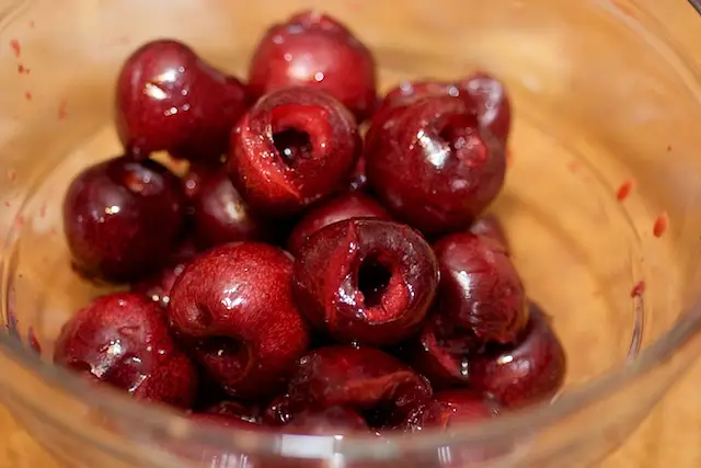 All the cherries are well pitted, and all the juice is kept in the bowl.
