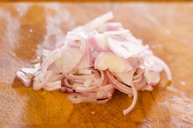 Thinly slice the shallot or red onion.