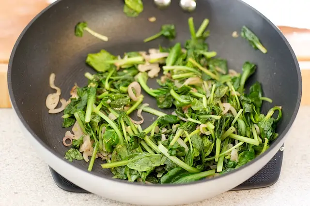 Cook until the spinach is wilted but still bright green, 2 to 3 minutes. 