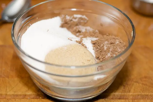 In a small bowl, add ⅓ cup of cocoa powder, brown sugar, and ⅓ cup sugar, 