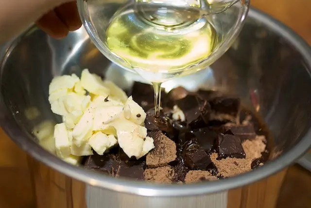 Add the butter, canola oil, remaining ⅓ cup of cocoa powder, and chocolate in a small bowl