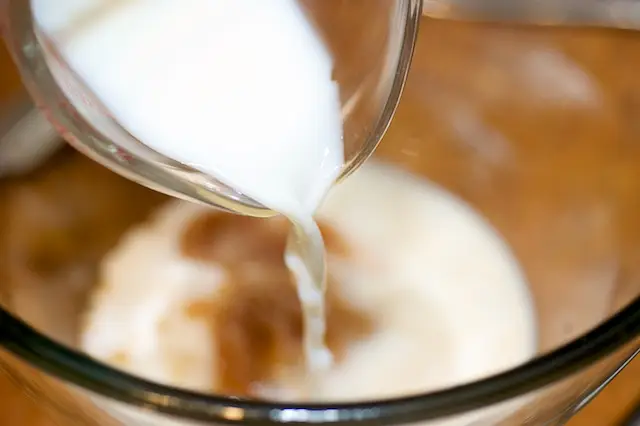 Add the milk and salt, and whisk until well blended.