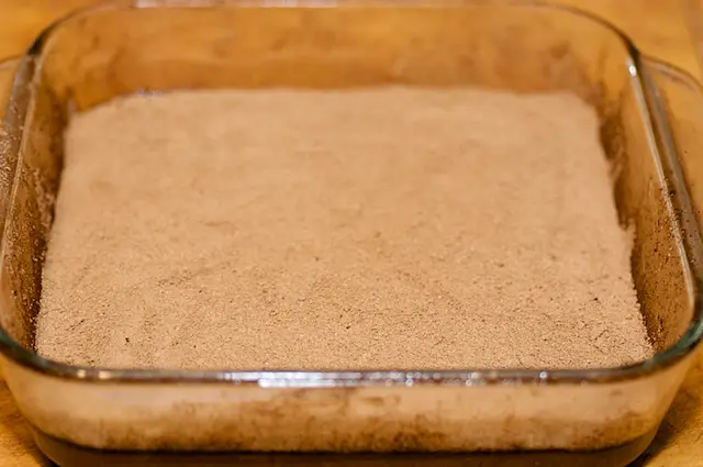 until all the mixture is finished, and the batter should be completely covered by the cocoa-sugar mixture. 