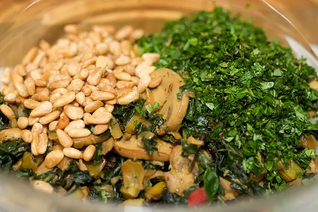 Remove from the heat, and transfer the vegetable mixture into a large bowl,