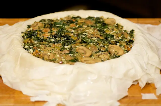 Spoon the filling into the crust and spread it evenly. 