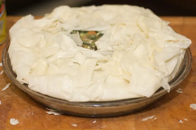 Fold all the overhanging phyllo sheets in over the filling, and try to arrange them evenly. 